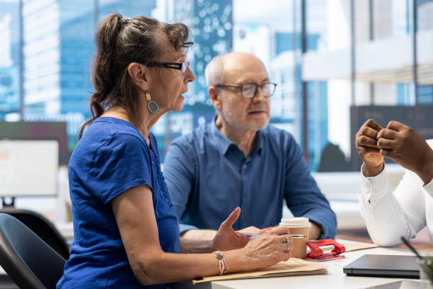 istock Senior citizens consulting a broker to explore pension options 2165441320