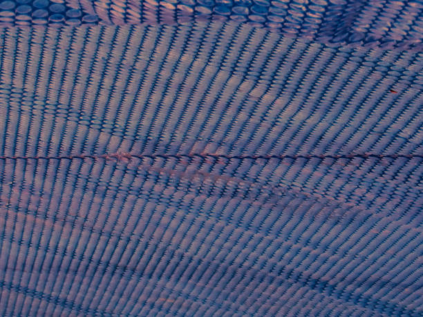 abstract background formed by a pool cover made of textured blue rubber, BERTIOGA, SAO PAULO,  BRAZIL.