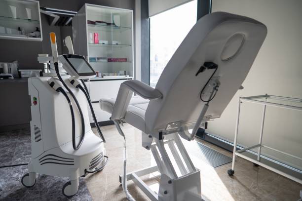 istock Empty beautician office with white couch and photorejuvenation machine. 2165444673