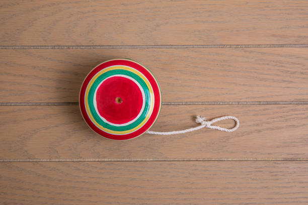 Handmade Mexican wooden toy.yoyo made of colored wood on a wooden table