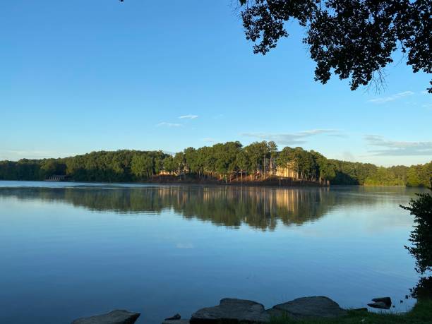 istock Sunrise Over a Tranquil Lake 2165446405
