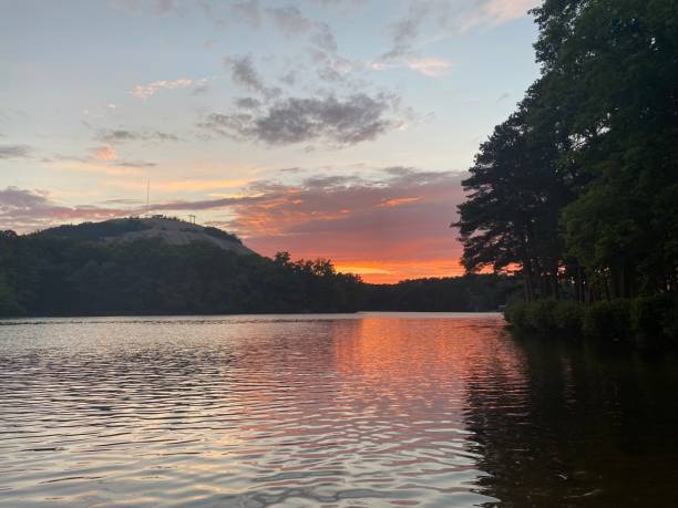 istock Vibrant Sunset Over Stone Mountain Lake 2165446416