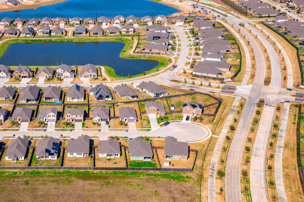 Panorama aerial view city water tower near construction site builder activity, new suburban homes Dallas Fort Worth, fast growing metropolitan to surrounding countryside in Princeton, Texas. USA