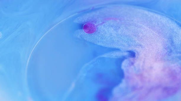 istock Sparkling paint shimmer ink blue purple oil bubble 2165449789