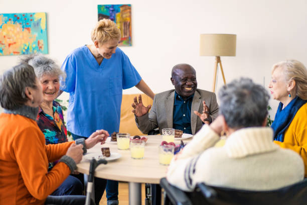 istock Senior people taking refreshments together 2165450687