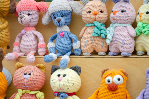 istock Designer soft knitted toys for sale 2165452675