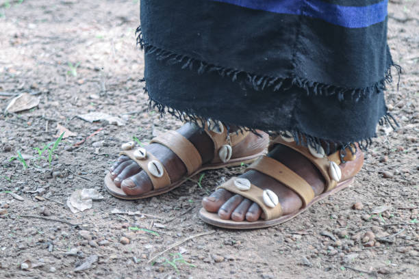istock Child's feet with sandals 2165454305