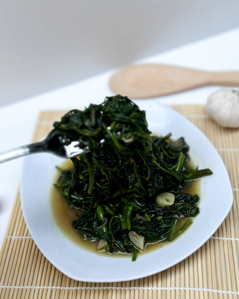 istock Stir-fried kale. Stir-fried kale or sometimes called stir-fried kale or cah kangkung is a stir-fried vegetable dish that is commonly found in Asian dishes 2165455599