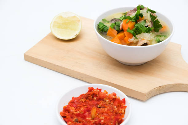istock Pork soup in a white bowl with crushed chilies 2165455902