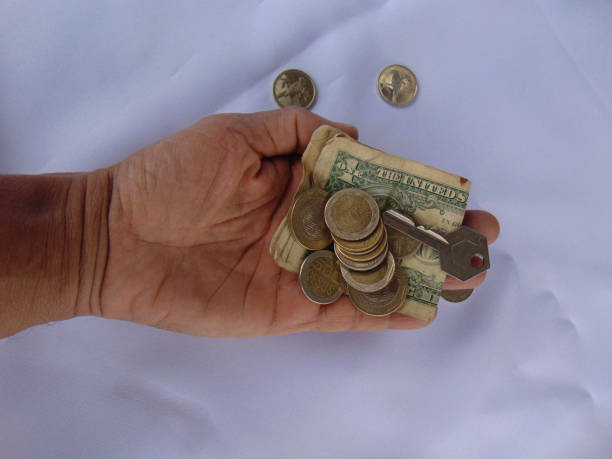 istock Hand of a man holding dollars 2165458658