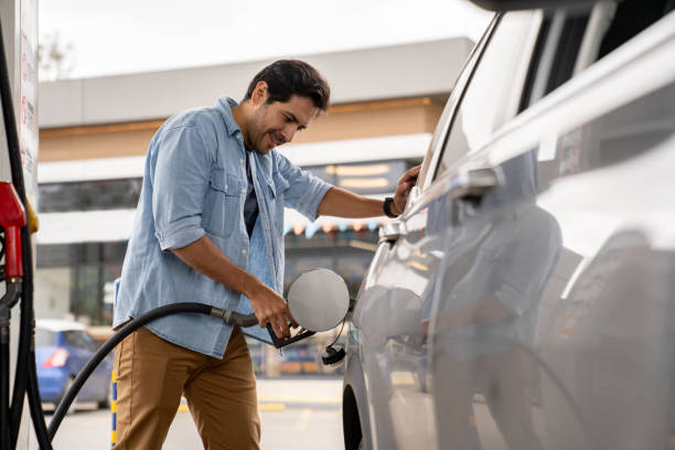 istock Man refueling his car at a petrol station 2165462185