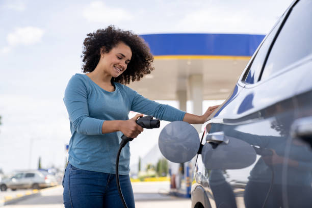 istock Woman charging an electric car 2165462254