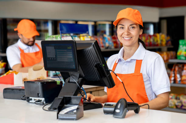 istock Happy cashier at a convenience store 2165462296