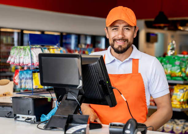 istock Retail clerk smiling while working at a convenience store 2165462304