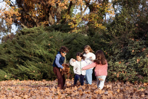 Happy kids running and enjoying a fall day - Buenos Aires - Argentina