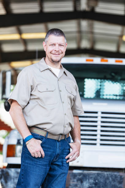istock Mature man with truck working at lumberyard 2165464408