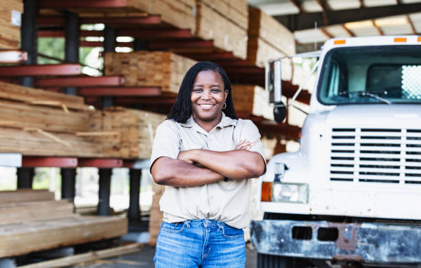 istock Mature black woman working at lumberyard 2165464417