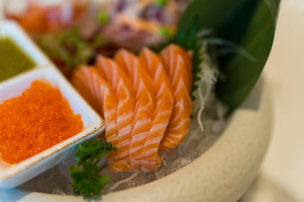 Salmon sashimi put into white bowl. Japanese food