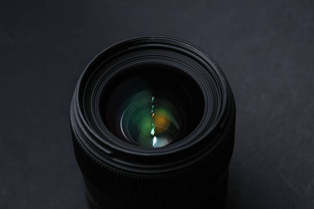 istock Professional lens on a black background. Photographer's equipment 2165468285