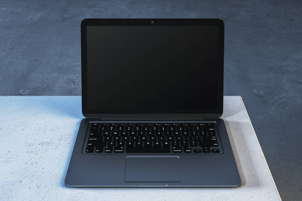 istock Modern laptop with blank screen on a concrete table. 3D Rendering 2165471363