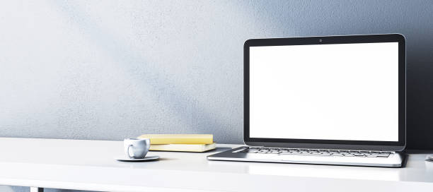 istock Modern laptop with blank screen on a clean white desk. 3D Rendering 2165471415