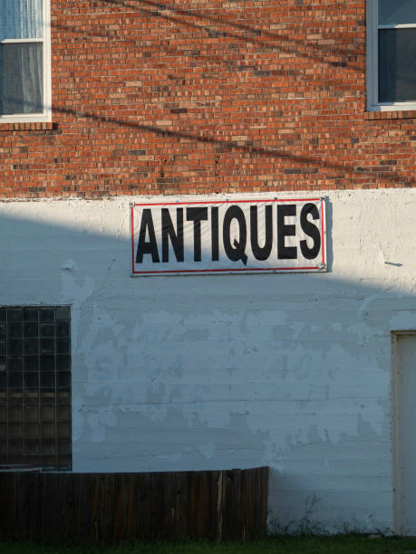 istock Antique Shop Sign on Brick Building 2165474093