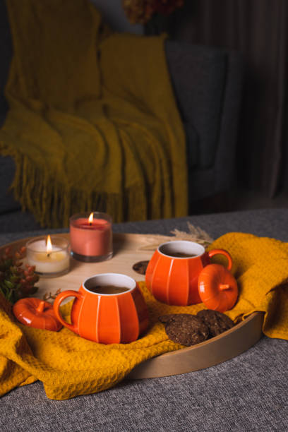 istock Fall cozy mood composition with hot drink and burning candles 2165474743