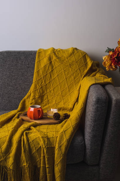 istock Fall cozy mood composition with hot drink and burning candles 2165474746
