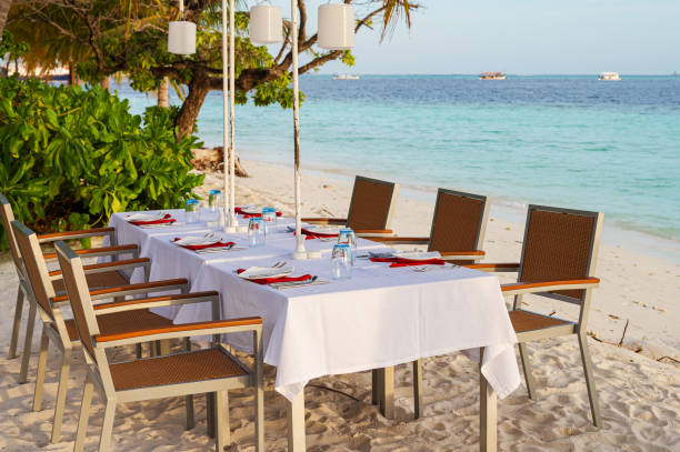 istock Table for dinner on the tropical beach at Maldives Islands 2165476324