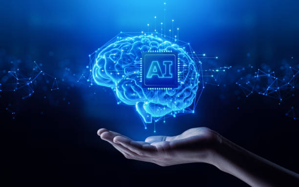 istock AI and Machine Learning: Hand Holding a Human Brain with an artificial intelligence Chip. Big data, network, Science and futuristic concept 2165478137