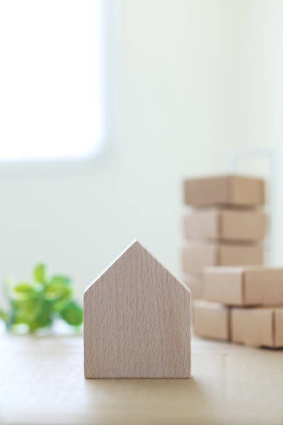 istock Image of moving estimate using house models and cardboard miniatures 2165478299
