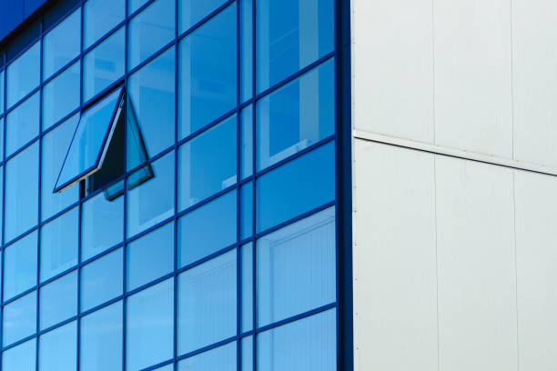 istock glass office modern building local close up architecture scape open window and corner part of apartment with white wall empty copy space for your text here 2165478454