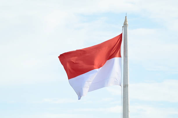 istock Indonesian flag with sky as background 2165480670