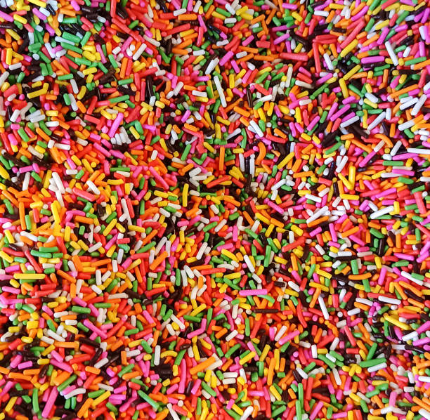 istock Colorful sprinkles sugar icing topping background 2165480807