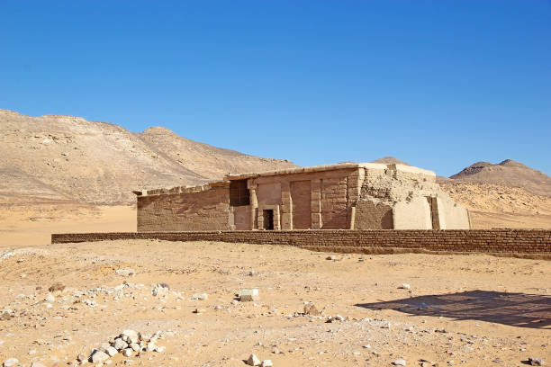Bent Pyramid, Dashur Necropolis, Egypt - July 27, 2022:  The Bent Pyramid is an ancient Egyptian pyramid located at the royal necropolis of Dahshur, approximately 40 kilometres south of Cairo, built under the Old Kingdom Pharaoh Sneferu (c. 2600 BC). A unique example of early pyramid development in Egypt, this was the second pyramid built by Sneferu.The Bent Pyramid rises from the desert at a 54-degree inclination, but the top section (above 47 metres) is built at the shallower angle of 43 degrees, lending the pyramid a visibly 'bent' appearance.