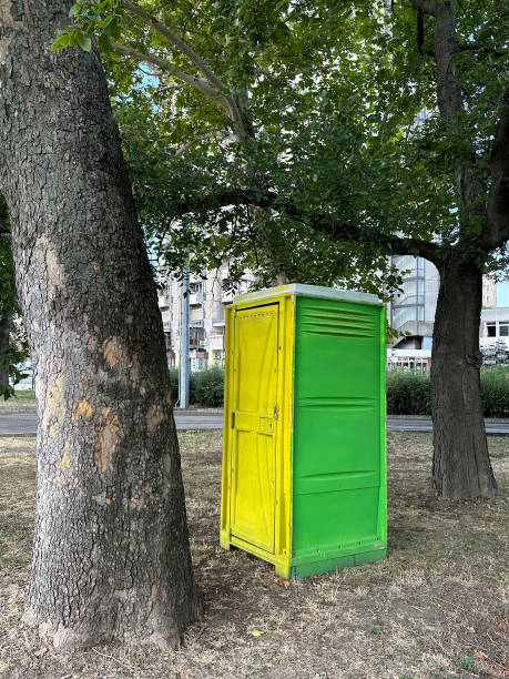 istock Portable toilet in the park between two trees 2165481386