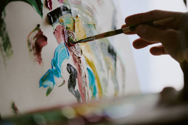 istock Male Hand Painting On Canvas 2165482023