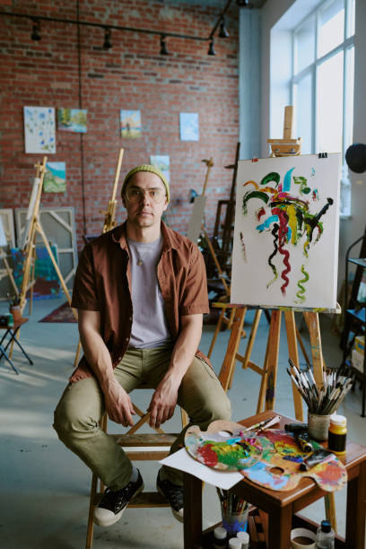 istock Creative Male Artist Sitting In His Studio 2165482033