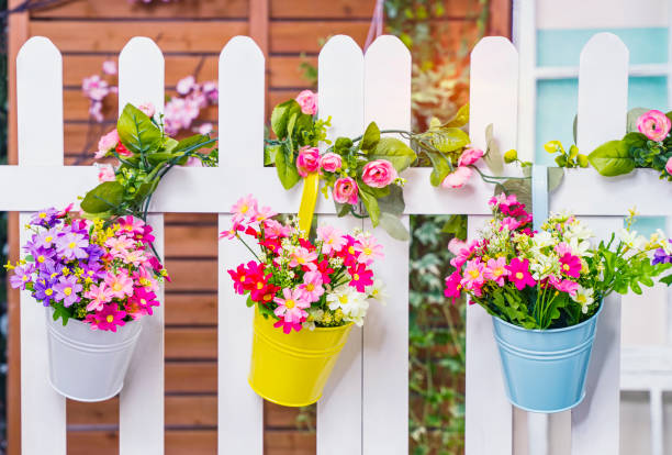 istock Hanging Flower Pots with fence 2165482350