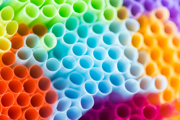 Colorful plastic drinking straws, close up as background