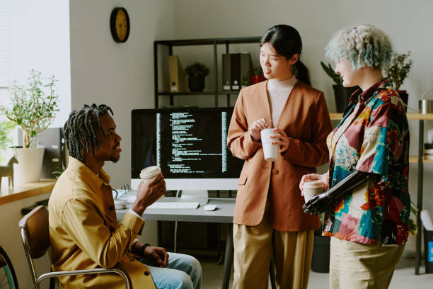istock Stylish Coworkers Having Coffee Break 2165483918