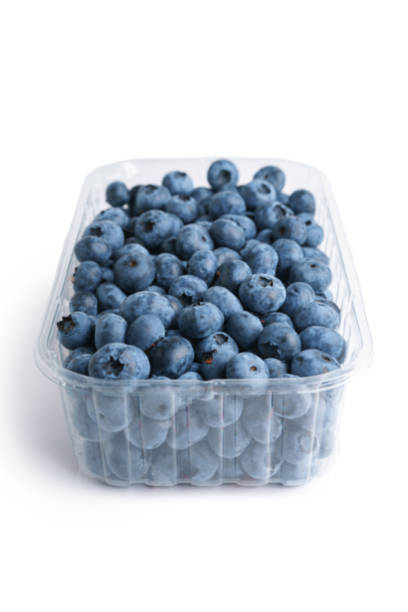 istock Fresh raw organic blueberries in transparent plastic container isolated on white background 2165484032