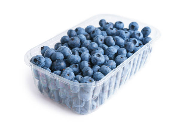 istock Fresh raw organic blueberries in transparent plastic container isolated on white background 2165484037