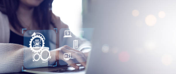 istock Automation concepts for automating the optimization of business processes. Businessman using laptop with automation icon on virtual screen 2165484263