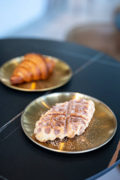 Breakfast - Croissant on wooden table