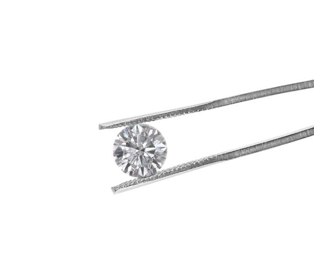 istock Cut Beautiful diamond held by tweezers on white background 2165493419
