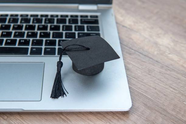 istock A graduation cap and a laptop. 2165494365
