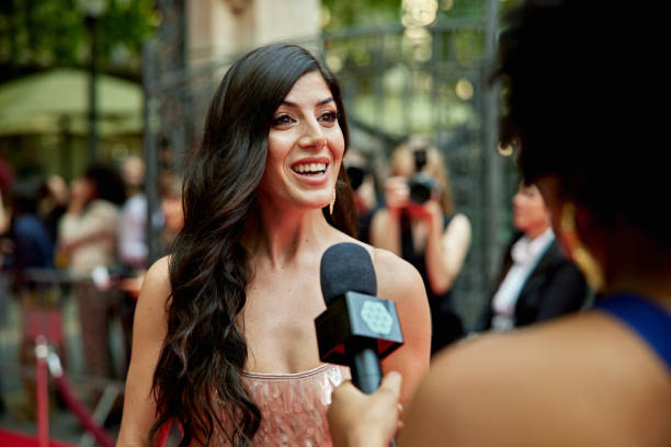 istock Mid 30s celebrity talking with red carpet host 2165494416