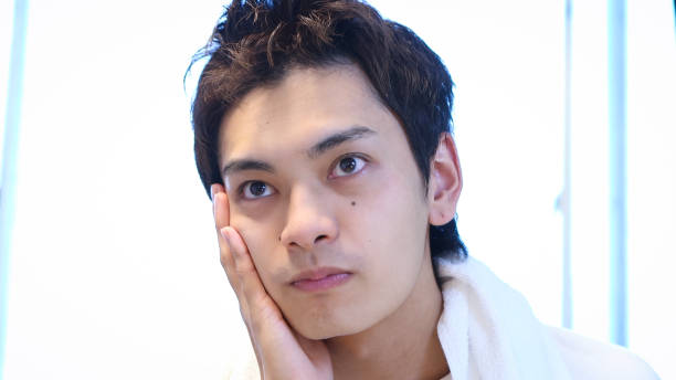 istock Young Asian Man Face Wash 2165496475