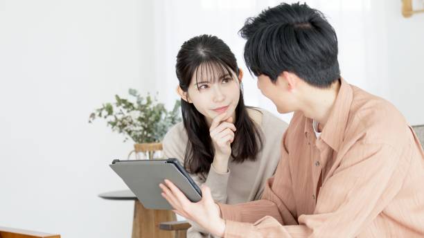 istock Couples browsing real estate and travel sites 2165501836